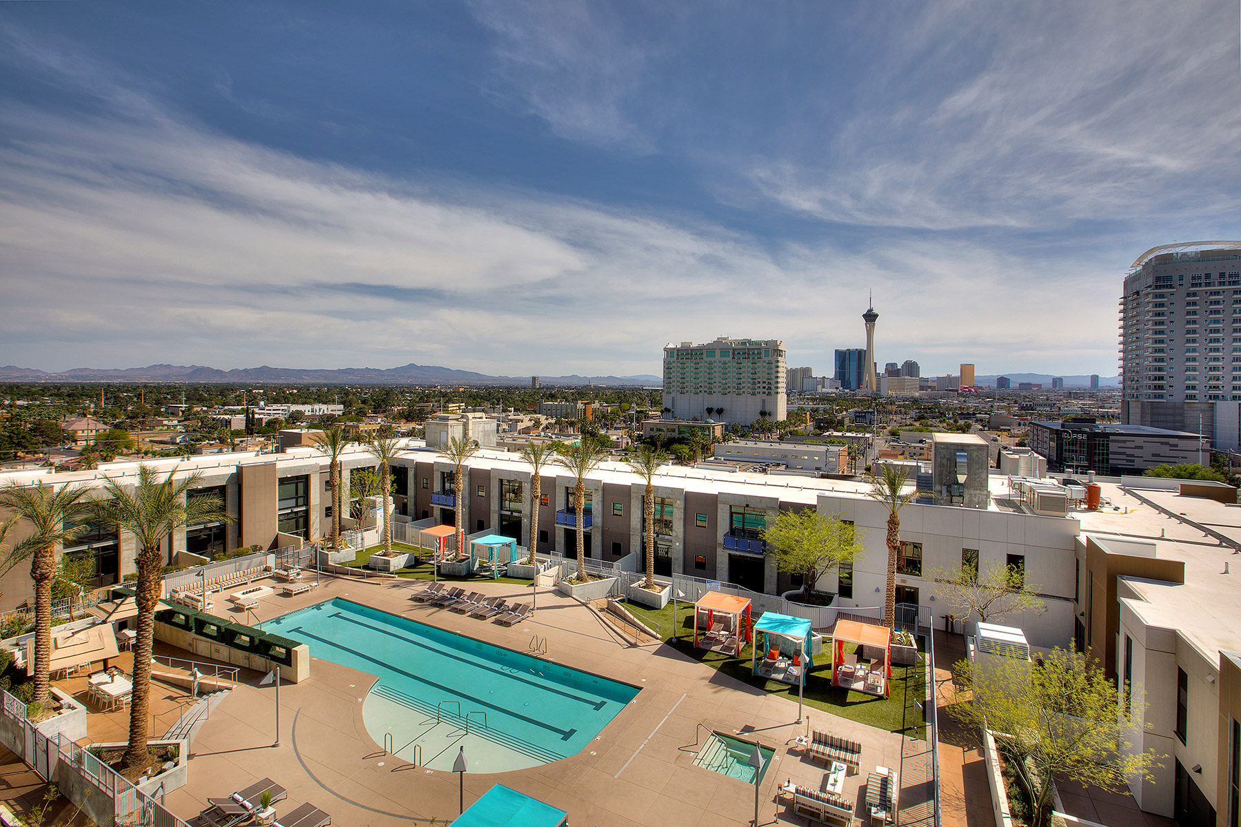 Aerial view of the resort style pool at Juhl with the Las Vegas Strip in the background
