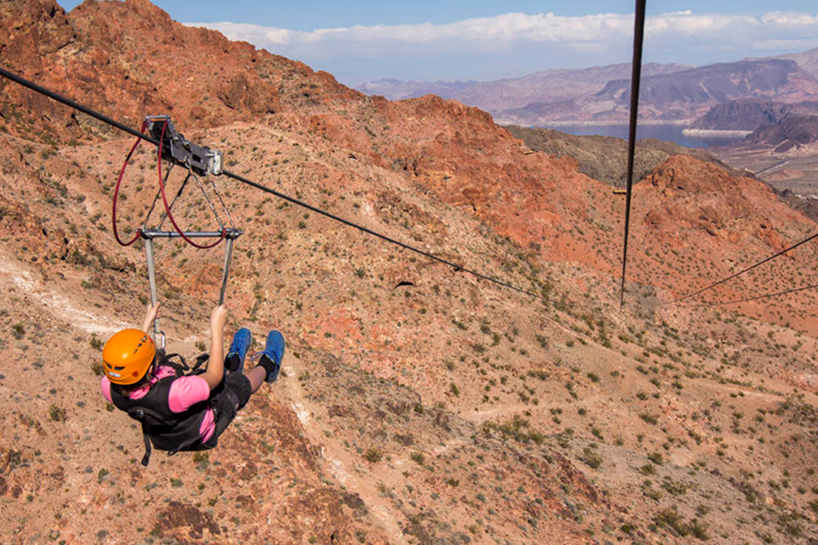 Girl enjoying ziplining through Bootleg Canyon.