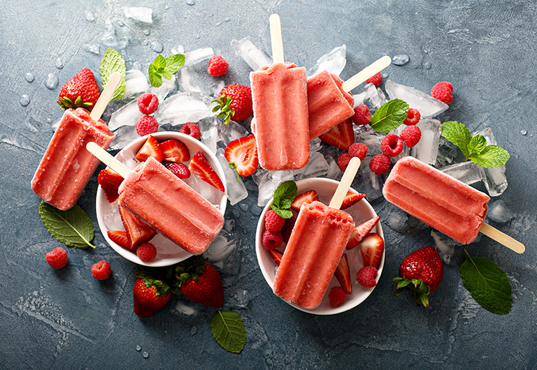 Homemade Summer Dessert of Strawberry Popsicles