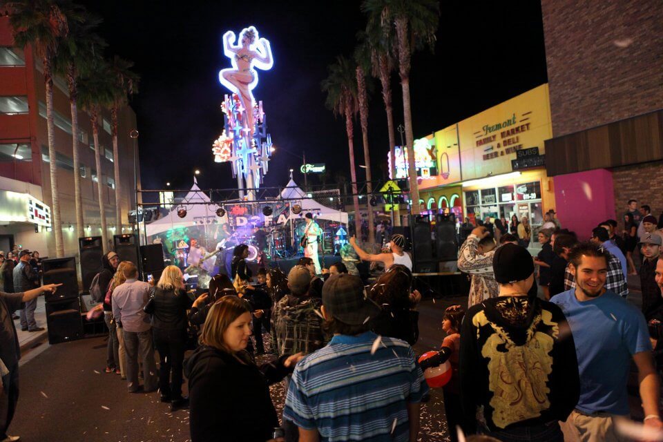 guests view art at night in downtown las vegas