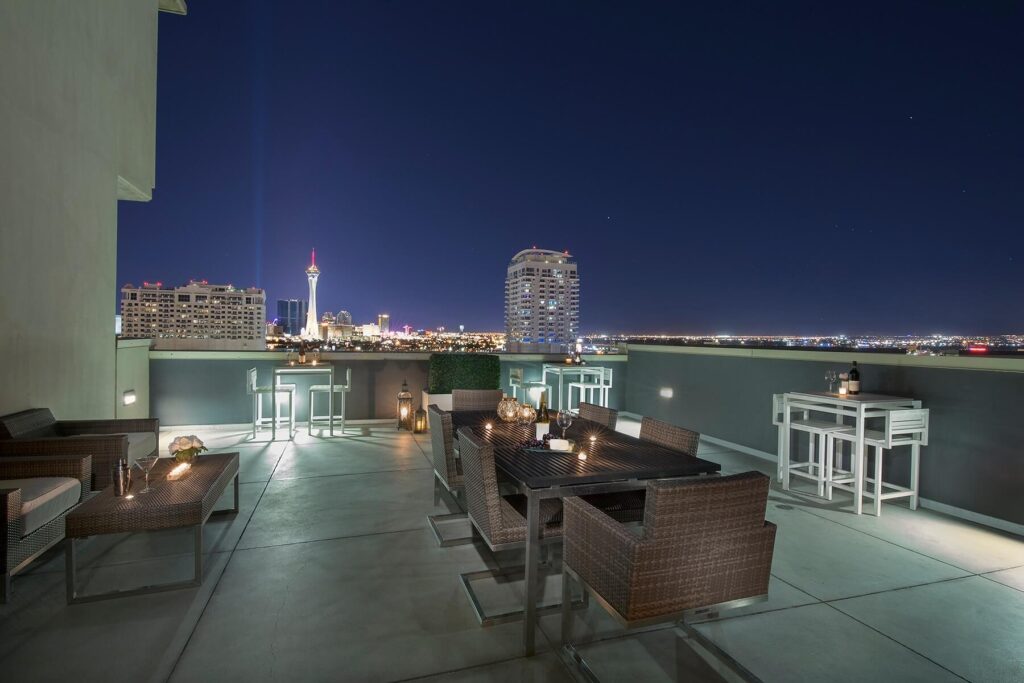 rooftop deck with dining table at juhl overlooks the strip in vegas