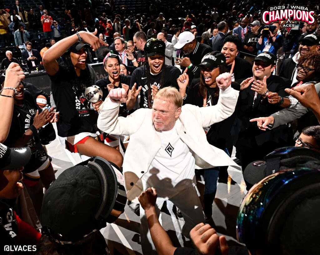 mark davis dances in celebration surrounded by media at aces championship win