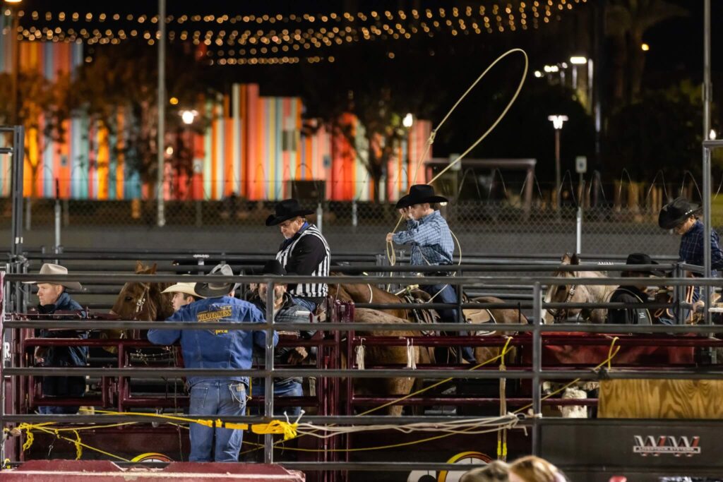 men on horses in corral at las vegas rodeo