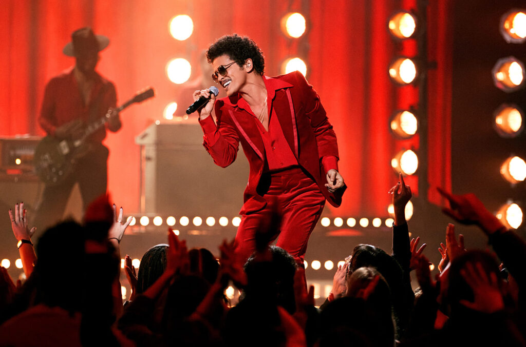 bruno mars performs on vegas stage in red suit